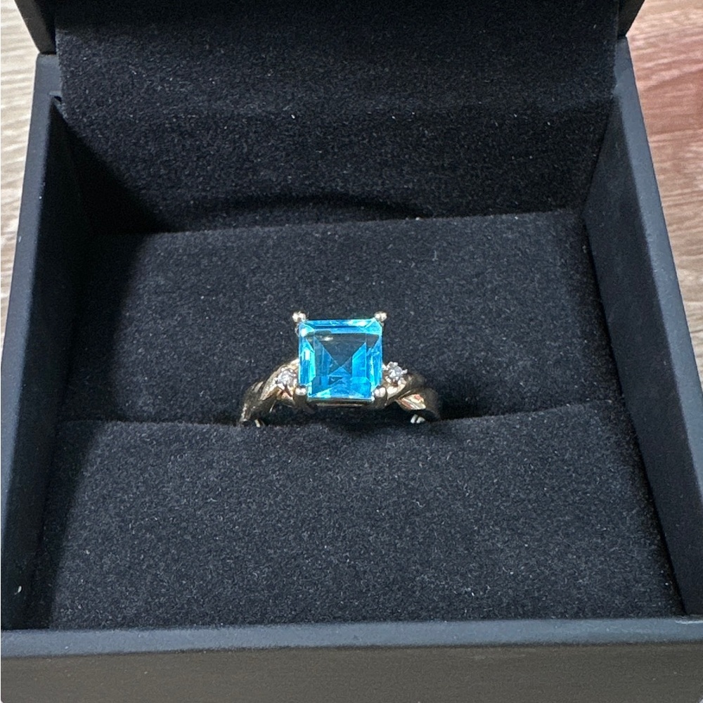 Blue topaz ring in 14k yellow gold with diamond accents